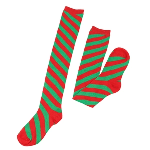 Macro detail of red and green diagonal striped knit over-the-knee Christmas socks