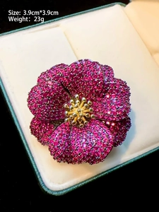 Detail of luxury peony flower brooch with purple gemstones in a gift box, size 3.9x3.9cm