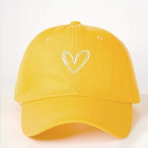 Yellow baseball cap featuring a white heart embroidery with adjustable strap for outdoor use
