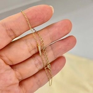 Detail of minimalist 14k gold plated S925 silver bracelet with sparkling bar inlay