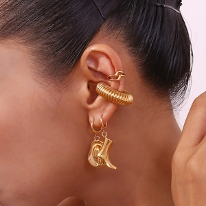 Gold double-layered wavy ear cuffs and cowboy hat boot pendants on a female model