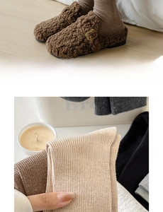 Detail view of cozy knit crew socks paired with warm faux shearling clog slippers