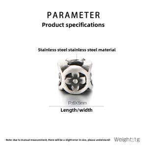 Macro detail of a 6x5mm vintage stainless steel cylinder bead with floral carvings