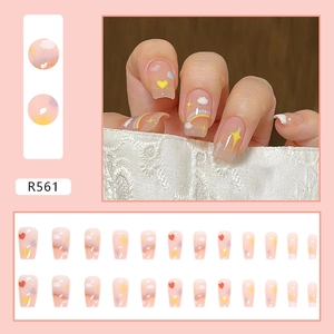 Detail of medium-long ballet nails with rainbow and cloud art in a pink translucent finish