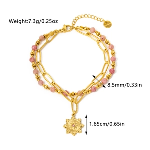 Detail view of double-layer gold bracelet with pink stone beads and star pendant specifications