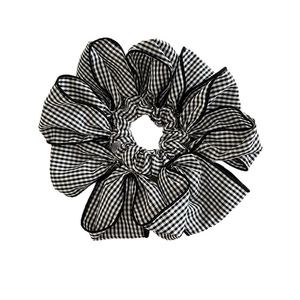 Classic black and white gingham scrunchie with lace edge and high-quality fabric texture