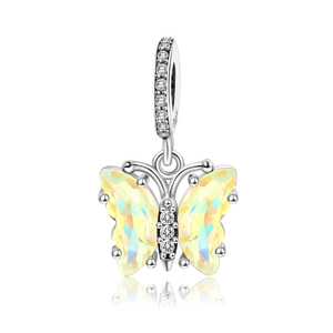 Macro shot of silver butterfly charm with yellow crystal wings and S925 engraved detail