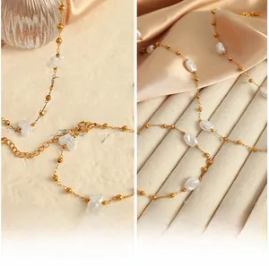 Detail of 18k gold plated necklace and bracelet set with irregular baroque pearls