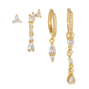Gold star and moon tassel earring set with inlaid cubic zirconia on white background