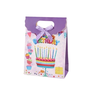 Purple birthday gift bag with rainbow Happy Birthday text and silk ribbon handles
