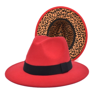 Detail view of red fedora hat featuring leopard print lining and black grosgrain ribbon band