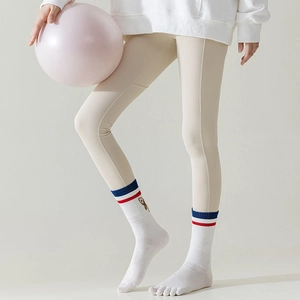 Close-up of white five-toe socks featuring striped cuffs and cute bear embroidery detail