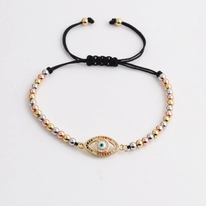 Adjustable evil eye braided bracelet with tri-color metallic beads and colorful zircons