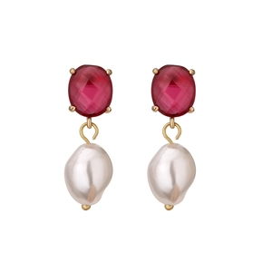 Detail of red oval-cut gemstone earrings with elegant white baroque pearls and gold plating