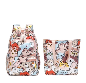 Pink school backpack and matching handbag set with cute cartoon cat patterns for girls