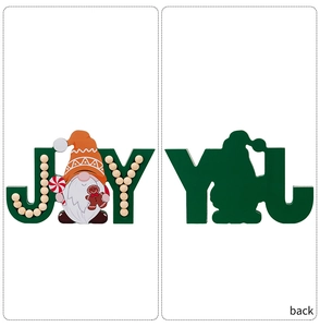 Detail of wooden Christmas JOY sign with gnome character and gingerbread man motifs