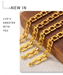 Detail of gold-plated geometric square link chain with secure lobster clasp closure