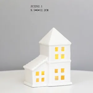 Detail of white ceramic house LED night light with 9.5x6x12.2cm dimensions