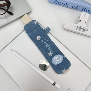 Detail of blue denim pencil case with star embroidery and elastic band for iPad stylus