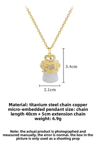 Detail of titanium steel necklace with white faux jade pendant and crystal crown