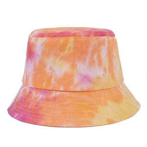 Foldable tie-dye bucket hat for women in vibrant pink, orange, and yellow canvas
