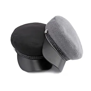 Classic wool blend newsboy hat set in black and grey with leather brim and metallic buttons
