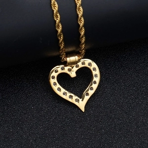 Macro shot of 316 stainless steel heart pendant with sparkling cubic zirconia inlay