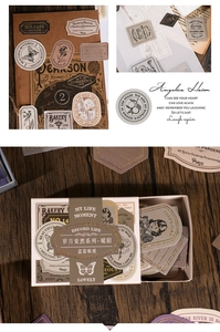 Detailed close-up of vintage butterfly and floral gold-stamped stickers on wood