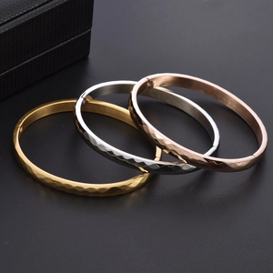 Titanium steel faceted bangle set in gold silver and rose gold with secure buckle