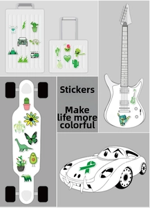 Detail showing green hand-drawn VSCO stickers on a suitcase and electric guitar