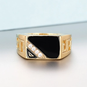Vintage gold ring featuring black enamel inlay with zircon accents and Greek key pattern