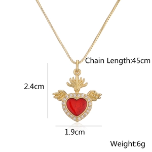 Detail of winged heart pendant with red gem and clear zircon, including size measurements