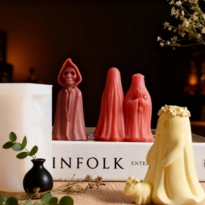 Detailed view of Halloween reaper and ghost candles with silicone molds for DIY crafting