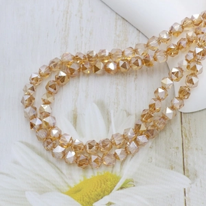 Macro shot of 6mm faceted amber glass beads with crystal refraction for jewelry DIY