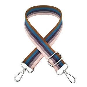 Detail of adjustable rainbow striped bag strap with shiny silver lobster metal clasps