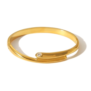 Minimalist 18K gold stainless steel bangle featuring a sparkling single crystal gemstone