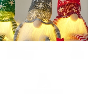 Three glowing Christmas gnomes with LED lights, snowflake knit hats and white faux fur beards