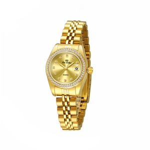 Close-up of gold quartz watch with rhinestone bezel, calendar display, and metal link strap