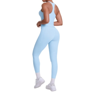 Light blue yoga set featuring racerback sports bra and side pocket high waist leggings
