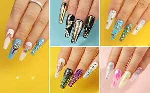 Detailed close-up of acrylic nail set with gold stars, rhinestones and holographic sequins