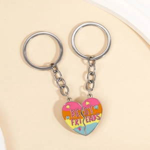 Close-up of magnetic heart-shaped best friends keychains with colorful enamel finish
