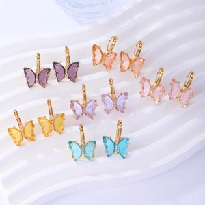 Macro shot of colorful transparent crystal butterfly earrings in six different vibrant shades