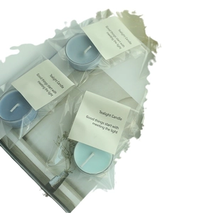 Blue tea light candles in bulk packaging with labels for romantic ambient lighting