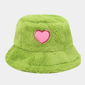 Green plush bucket hat with a pink heart patch, warm winter furry headwear for women