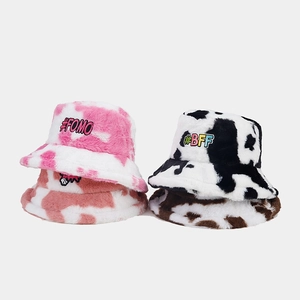 Plush cow print bucket hats with embroidered letters for winter street fashion