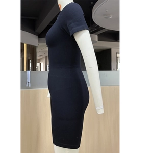 Close-up of seamless black ribbed knitting fabric with elastic zipper detail on sports romper
