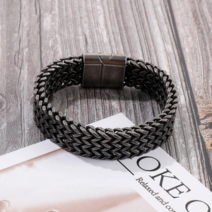 Close-up of gunmetal multi-layer box chain bracelet with magnetic clasp on wood
