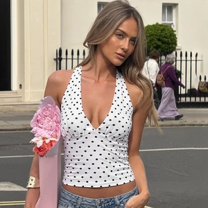 Detail of white v-neck halter top with black polka dots and stylish backless tie design