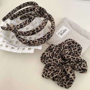 Retro leopard print hair accessory set with wide headband and elastic scrunchie