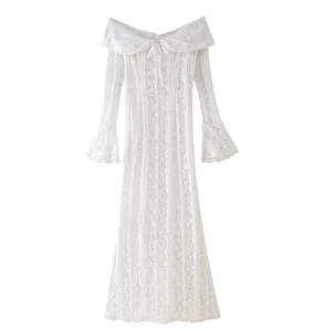 Close-up of white lace texture and off-shoulder design on an elegant long sleeve dress